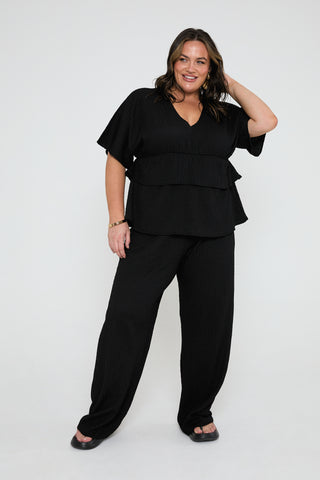Loose fit textured trousers in black