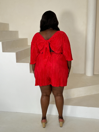 Angel sleeve tie back plisse playsuit in red